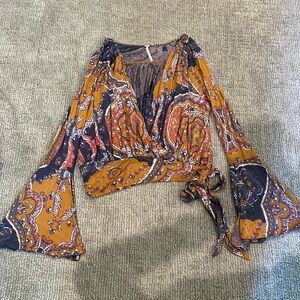 Free People top size M bell sleeves, side tie, deep V